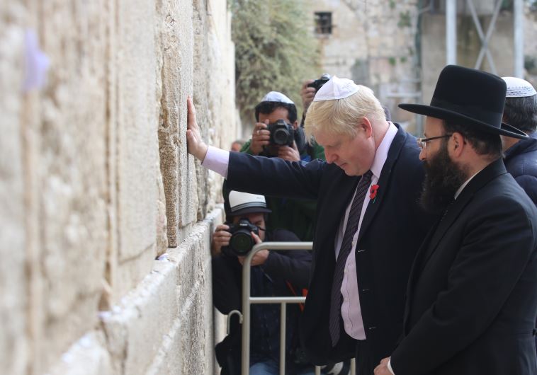 Boris prays at wall